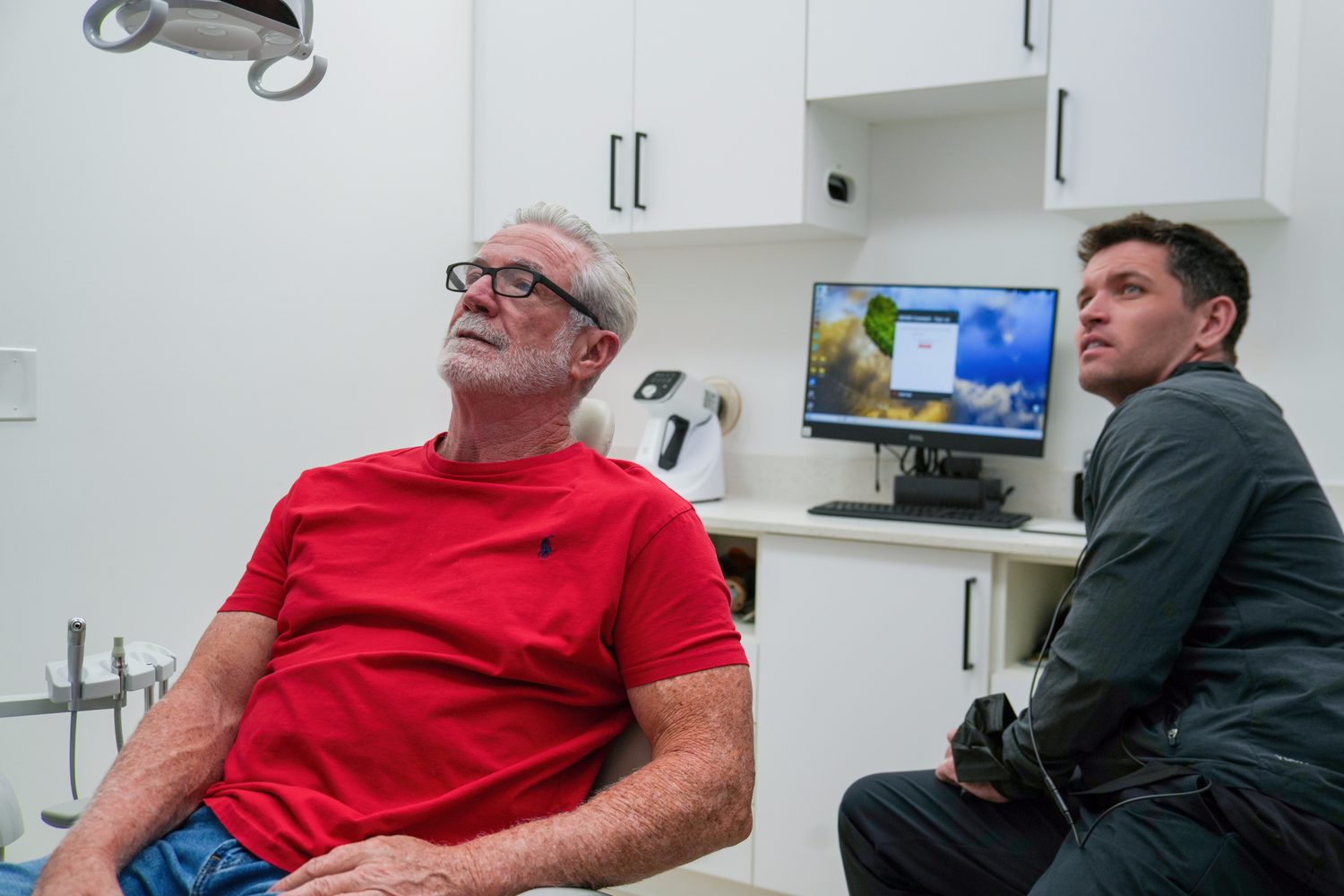 Dr. Dillon reviewing imaging with a patient chairside at MSD Dental Studio, Coral Springs
